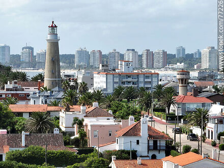 Aerial view of the lighthouse between the surrounding buildings and the distant ones - Punta del Este and its near resorts - URUGUAY. Photo #77226