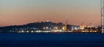 The port and the Cerro with its fortress illuminated at sunset - Department of Montevideo - URUGUAY. Photo #79094