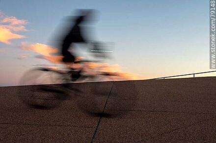 Cyclist on the promenade at sunset -  - MORE IMAGES. Photo #79148