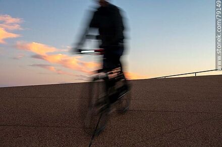 Cyclist on the promenade at sunset -  - MORE IMAGES. Photo #79149