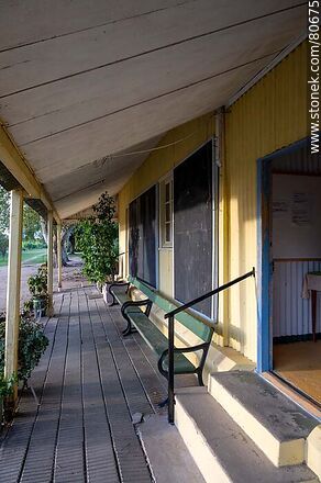 Risso train station turned into a library. Platform with benches of the old station - Soriano - URUGUAY. Photo #80675