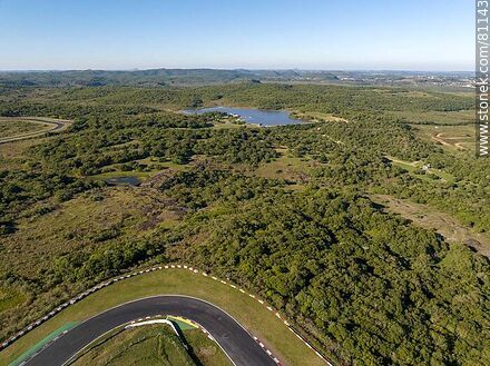 Aerial view of a curve of the racetrack and the Great Britain Park reservoir - Department of Rivera - URUGUAY. Photo #81143