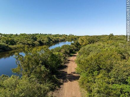 Aerial view of a road parallel to the Arapey Grande River in Termas del Arapey - Department of Salto - URUGUAY. Photo #81165