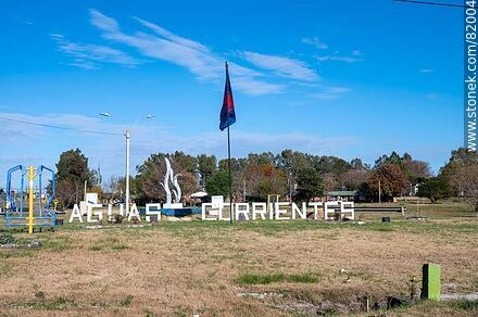 Aguas Corrientes sign and flag - Department of Canelones - URUGUAY. Photo #82004