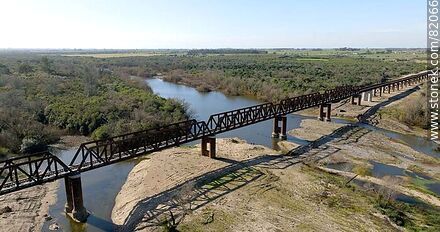 Aerial view of the recycled railroad bridge over the Santa Lucia river, departmental boundary between Canelones and Florida. Drought of 2023 - Department of Florida - URUGUAY. Photo #82066
