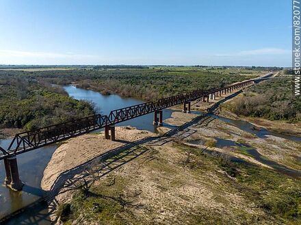 Aerial view of the recycled railroad bridge over the Santa Lucia river, departmental boundary between Canelones and Florida. Drought of 2023 - Department of Florida - URUGUAY. Photo #82077