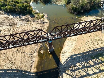 Aerial view of the recycled railroad bridge over the Santa Lucia river, departmental boundary between Canelones and Florida. Drought of 2023 - Department of Florida - URUGUAY. Photo #82078