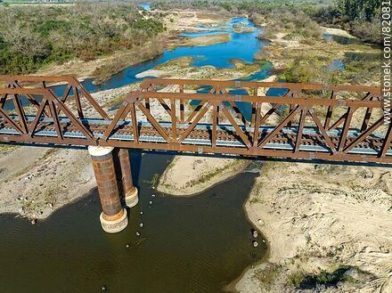 Aerial view of the recycled railroad bridge over the Santa Lucia river, departmental boundary between Canelones and Florida. Drought of 2023 - Department of Florida - URUGUAY. Photo #82081