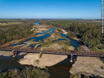 Aerial view of the recycled railroad bridge over the Santa Lucia river, departmental boundary between Canelones and Florida. Drought of 2023 - Department of Florida - URUGUAY. Photo #82084