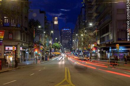 18 de Julio Avenue. Gaucho Tower. Trail of lights left by the traffic at dusk. - Department of Montevideo - URUGUAY. Photo #84534