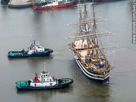 Aerial view of tugboats maneuvering with the training ship Amerigo Vespucci - Department of Montevideo - URUGUAY. Photo #84620