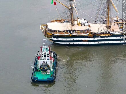 Aerial view of one of the tugboats maneuvering with the training ship Amerigo Vespucci - Department of Montevideo - URUGUAY. Photo #84626