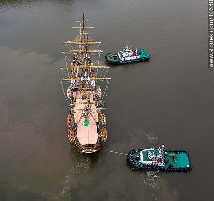 Aerial view of tugboats maneuvering with the training ship Amerigo Vespucci - Department of Montevideo - URUGUAY. Photo #84630