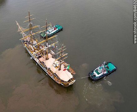 Aerial view of tugboats maneuvering with the training ship Amerigo Vespucci - Department of Montevideo - URUGUAY. Photo #84632