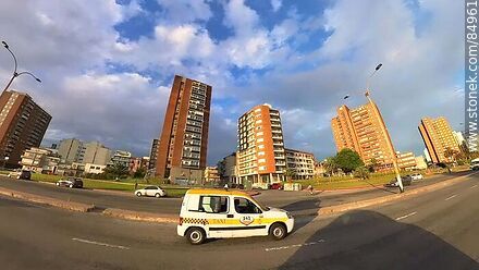 Cab van in front of buildings on Rambla Sur - Department of Montevideo - URUGUAY. Photo #84961