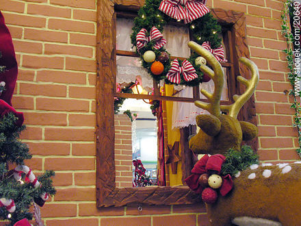 Deer doll in front of a Christmas window - Department of Montevideo - URUGUAY. Photo #20640