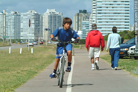 Boy on his bike - Punta del Este and its near resorts - URUGUAY. Photo #13110