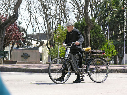 Priest and bicycle - Department of Colonia - URUGUAY. Photo #26434