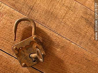 Old rusty padlock and key, on a table.  -  - MORE IMAGES. Photo #8761