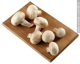 Raw mushrooms on little board -  - MORE IMAGES. Photo #8814